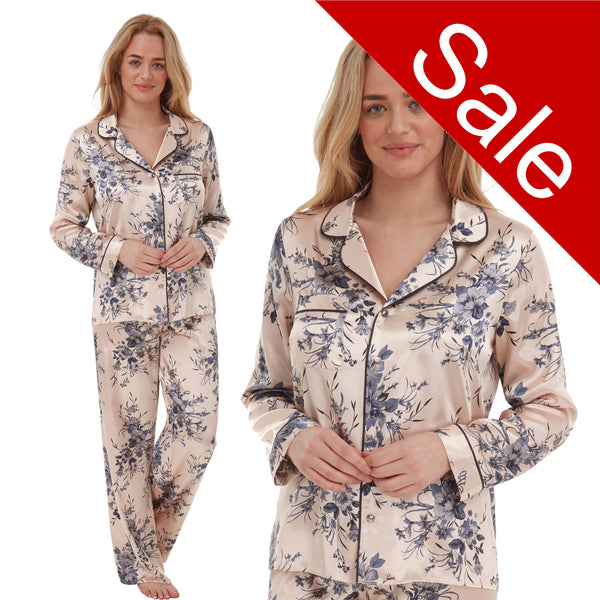 gold background with a blue floral print silky shiny satin pjs set consisting of a shirt style top with full length sleeves, a collar, top pocket and a button up front with matching full length trousers in UK plus sizes 18, 20, 22, 24, 26, 28