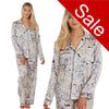 ivory background with a blue animal print silky shiny satin pjs set consisting of a shirt style top with full length sleeves, a collar, top pocket and a button up front with matching full length trousers in UK size 14, 16, 