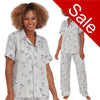 grey floral & butterfly print mat satin pjs set consisting of a shirt style top with a collar, top pocket and button up front with matching full length trousers with an elasticated waist band in UK sizes 10, 12, 