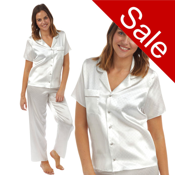 Ivory jacquard spot print satin pjs set consisting of a shirt style top with a collar, top pocket and button up front with matching full length trousers with an elasticated waist band in UK size 18