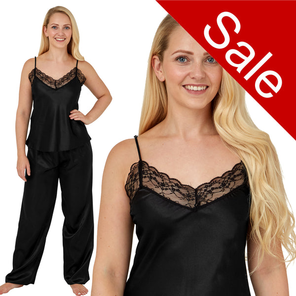 plain black shiny silky satin pjs set which comes with a cami top with adjustable straps and lace trim. The trousers are full length with an elasticated waist band in UK plus sizes 12, 14, 16, 