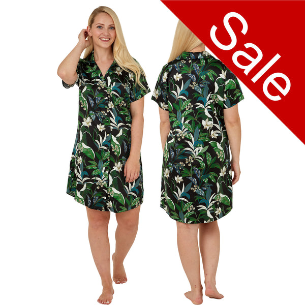 ladies black background with a large green floral print in mat satin nightshirt with a button front, collar, top pocket, short sleeve and shirt style hem in UK plus size 24, 26