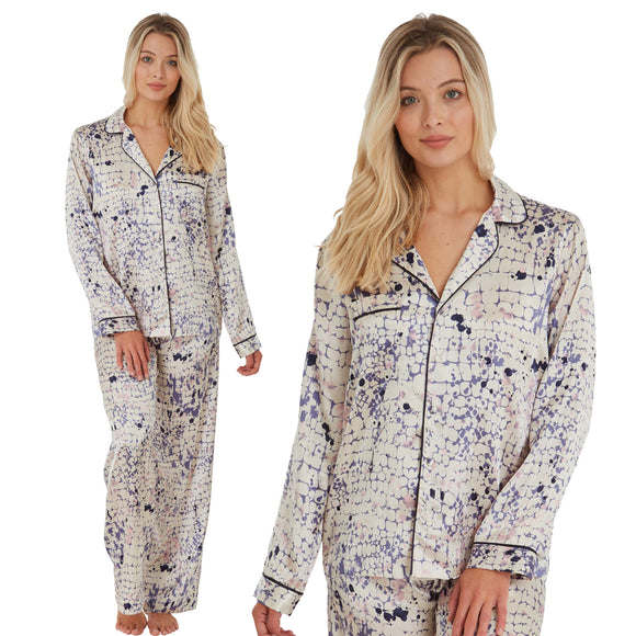 ivory background with a blue animal print silky shiny satin pjs set consisting of a shirt style top with full length sleeves, a collar, top pocket and a button up front with matching full length trousers in UK sizes 14, 16, 18, 20
