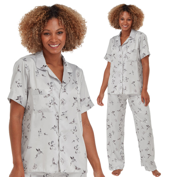 grey floral & butterfly print mat satin pjs set consisting of a shirt style top with a collar, top pocket and button up front with matching full length trousers with an elasticated waist band in UK sizes 10, 12, 14, 16, 18, 20
