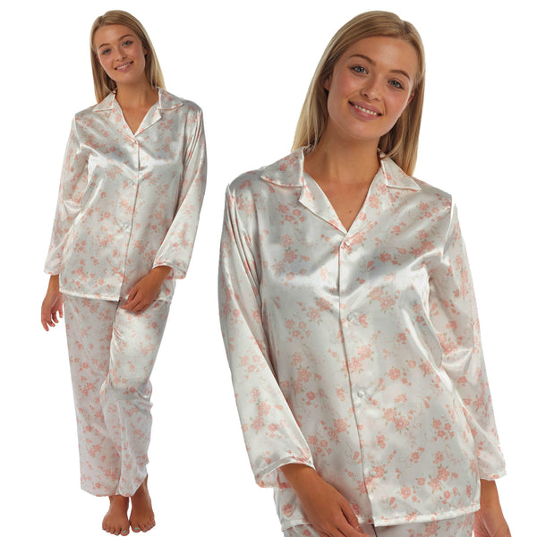 ivory background with a peach/pink floral print silky shiny satin pjs set consisting of a shirt style top with full length sleeves, a collar, top pocket and a button up front with matching full length trousers in UK sizes 10, 12, 14