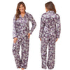 Lilac purple floral shiny satin pjs set consisting of a shirt style top with a collar, top pocket and button up front with matching full length trousers with an elasticated waist band in UK plus size 10, 12, 14, 16, 18, 20, 22, 24, 26, 28