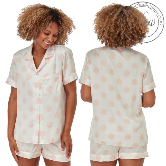 White with large pink spot print satin pjs set and they consist of a shirt style top with a collar, top pocket and button up front and short sleeves with matching shorts with an elasticated waist band. In UK size 10, 12, 14, 16, 18, 20