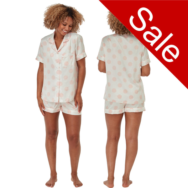White with large pink spot print satin pjs set and they consist of a shirt style top with a collar, top pocket and button up front and short sleeves with matching shorts with an elasticated waist band. In UK size 10, 12, 14, 16, 18, 20
