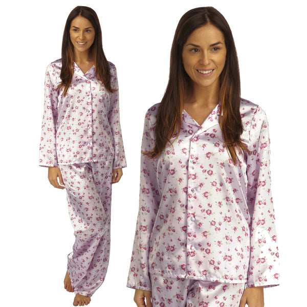 pink background with a darker pink poppy floral print silky shiny satin pjs set consisting of a shirt style top with full length sleeves, a collar, top pocket and a button up front with matching full length trousers in UK sizes 12, 14