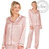 Pink jacquard star print shiny satin pjs set consisting of a shirt style top with a collar, top pocket and button up front with matching full length trousers with an elasticated waist band in UK plus size 14, 16, 18, 20, 22, 24, 26, 28
