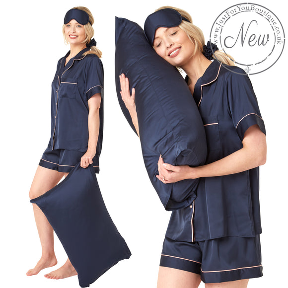 Plain dark navy blue matt satin pjs set consisting of a shirt style top with a collar, top pocket and button up front and short sleeves with matching shorts with an elasticated waist band. The pjs also come with a matching pillow case, eye mask and bobble. In UK size 14, 16, 18, 20