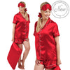 Red plain shiny satin pjs set consisting of a shirt style top with a collar, top pocket and button up front and short sleeves with matching shorts with an elasticated waist band. The pjs also come with a matching pillow case, eye mask and bobble.  In UK size 14, 16, 18, 20