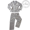 plain silver grey mat satin pjs set. They have a shirt style top with full length sleeves, a collar, top pocket and button up front. The trousers are full length with an elasticated waist band in UK plus sizes 22, 24, 26, 28