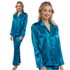 plain teal blue shiny silky satin pjs set which are warmer because its cotton lined. They have a shirt style top with full length sleeves, a collar, top pocket and button up front. The trousers are full length with an elasticated waist band in UK plus sizes 8, 10, 12, 14, 16, 18, 20, 22, 24, 26, 28, 30, 32, 34