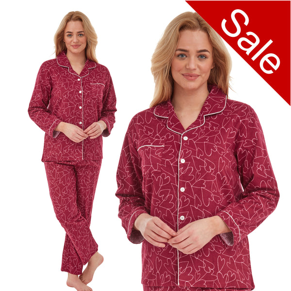 ladies red background with a heart print brushed cotton winter pyjamas pjs set with a shirt style which has a button front, collar and long sleeves and full length trousers in UK sizes 8, 10, 12, 14, 16, 18, 20