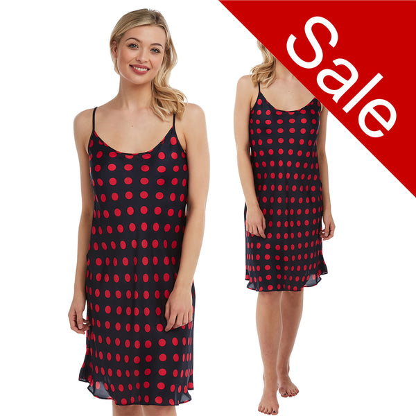 black background with a large red polka dot spot print satin chemise nightie which is knee length with adjustable straps and a round neck detail in UK sizes 12, 14, 16, 18, 