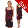 black background with a large red polka dot spot print satin chemise nightie which is knee length with adjustable straps and a round neck detail in UK sizes 12, 14, 16, 18, 
