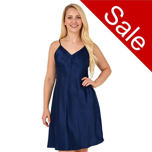 plain navy blue shiny silky satin chemise nightie which is knee length with adjustable straps and a vee neck detail in UK sizes 12, 14,