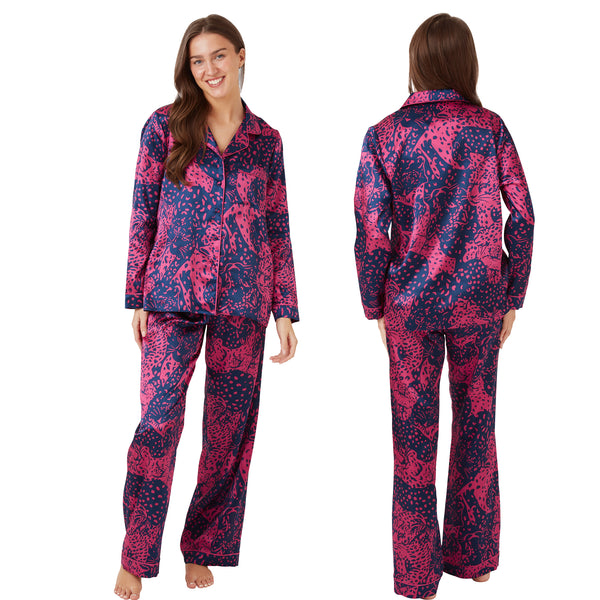 Hot pink oversized animal print shiny satin pjs set consisting of a shirt style top with a collar, top pocket and button up front with matching full length trousers with an elasticated waist band in UK sizes 10, 12, 14, 16, 18, 20