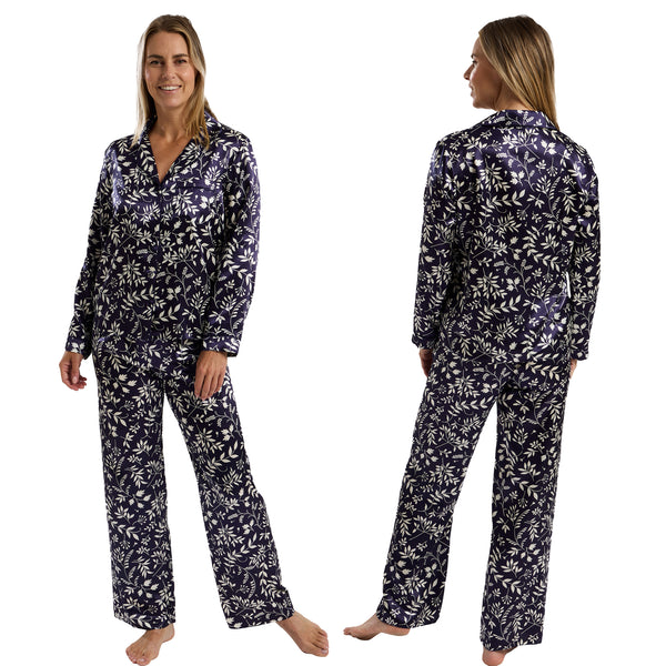 Autumn navy blue leaf floral print shiny satin pjs set consisting of a shirt style top with a collar, top pocket and button up front with matching full length trousers with an elasticated waist band in UK size 10-12
