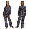 Autumn navy blue leaf floral print shiny satin pjs set consisting of a shirt style top with a collar, top pocket and button up front with matching full length trousers with an elasticated waist band in UK size 10-12