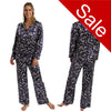 Autumn navy blue leaf floral print shiny satin pjs set consisting of a shirt style top with a collar, top pocket and button up front with matching full length trousers with an elasticated waist band in UK size 10-12