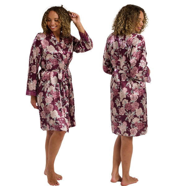 Claret purple oversized bloom floral print style in a silky shiny satin wrap, dressing gown, bathrobe, kimono which is knee length with adjustable straps and a vee neck detail in UK sizes 12, 14, 16, 18, 20, 22