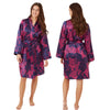 Hot pink oversized animal print style with a navy background in a silky shiny satin wrap, dressing gown, bathrobe, kimono which is knee length with adjustable straps and a vee neck detail in UK sizes 14, 16, 18, 20