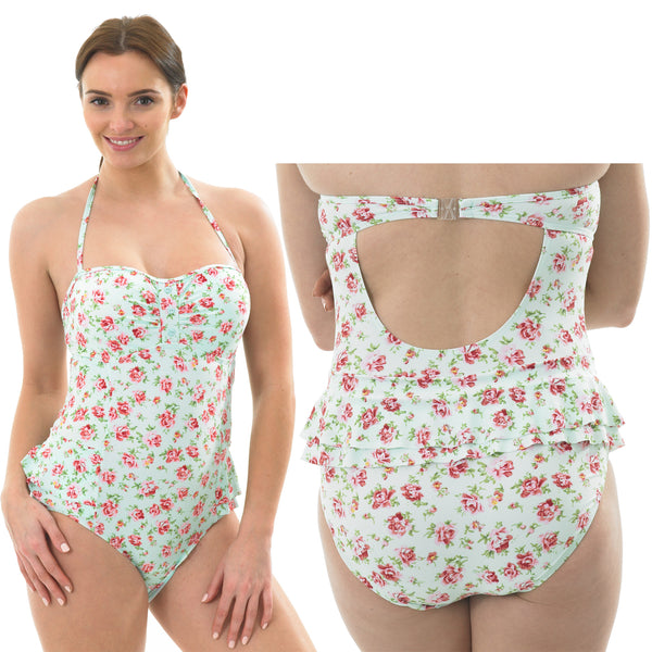 ladies halterneck swimsuit with an aqua background and a floral ditsy print and a small hip swimskirt in UK size 10