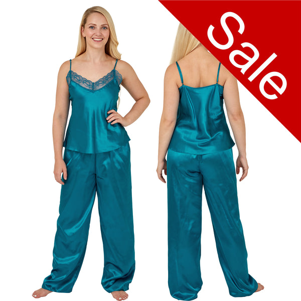 plain teal blue shiny silky satin pjs set which comes with a cami top with adjustable straps and lace trim. The trousers are full length with an elasticated waist band in UK sizes 12, 14, 16, 18, 