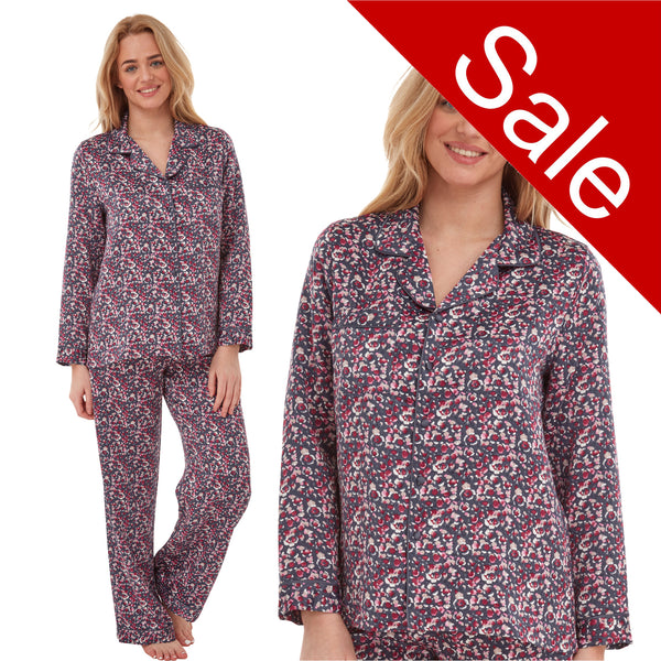 navy and pink ditsy floral print mat satin pjs set consisting of a shirt style top with full length sleeves, a collar, top pocket and a button up front with matching full length trousers in UK sizes 18, 20