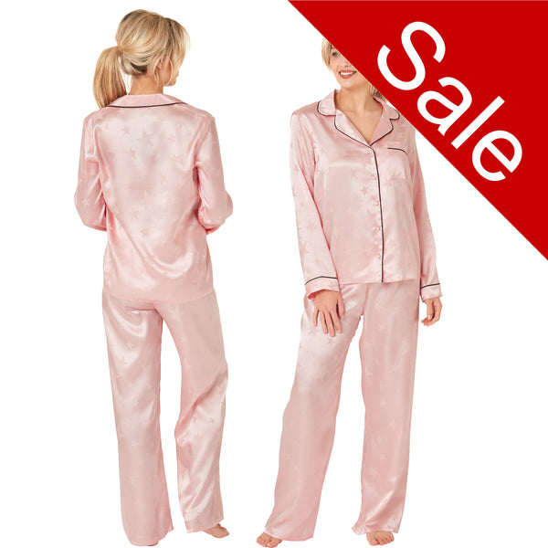 Pink jacquard star print shiny satin pjs set consisting of a shirt style top with a collar, top pocket and button up front with matching full length trousers with an elasticated waist band in UK plus size 14, 16, 18, 20, 22, 24, 26, 28