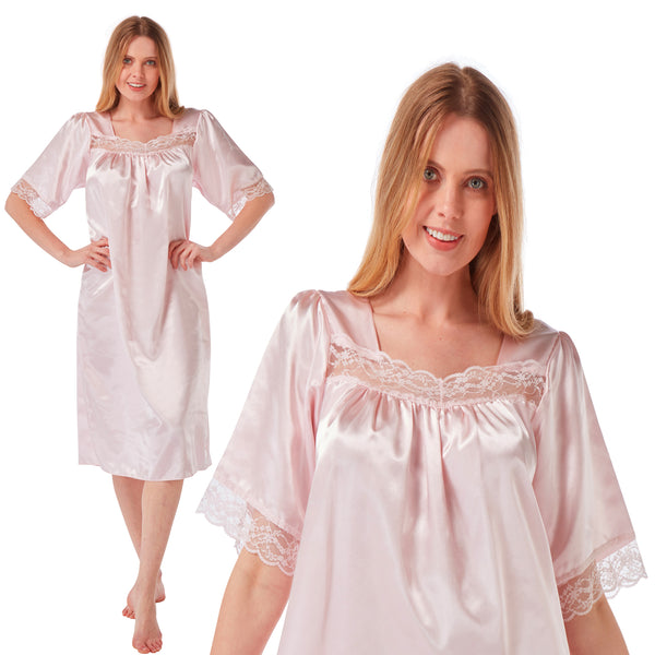 plain light pink shiny silky satin classic style mid length nightdress which is straight in fit with gathered fabric to the chest and elbow length sleeves. The chest and sleeves are trimmed with floral lace and it it available in UK plus sizes 8, 10, 12, 14, 16, 18, 20, 22, 24, 26, 28, 30, 32, 34