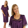 plain cadbury purple shiny silky satin classic style mid length nightdress which is straight in fit with gathered fabric to the chest and elbow length sleeves. The chest and sleeves are trimmed with floral lace and it it available in UK plus sizes 8, 10, 12, 14, 16, 18, 20, 22, 24, 26, 28, 30, 32, 34
