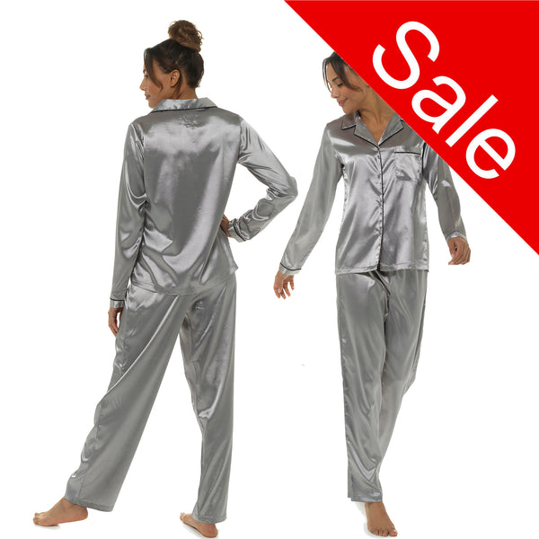 plain silver grey silky shiny satin pjs set consisting of a shirt style top with full length sleeves, a collar, top pocket and a button up front with matching full length trousers in UK sizes 8, 10, 