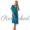 plain teal blue shiny silky satin classic style mid length nightdress which is straight in fit with gathered fabric to the chest and elbow length sleeves. The chest and sleeves are trimmed with floral lace and it it available in UK plus sizes 8, 10, 12, 14, 16, 18, 20, 22, 24, 26, 28, 30, 32, 34
