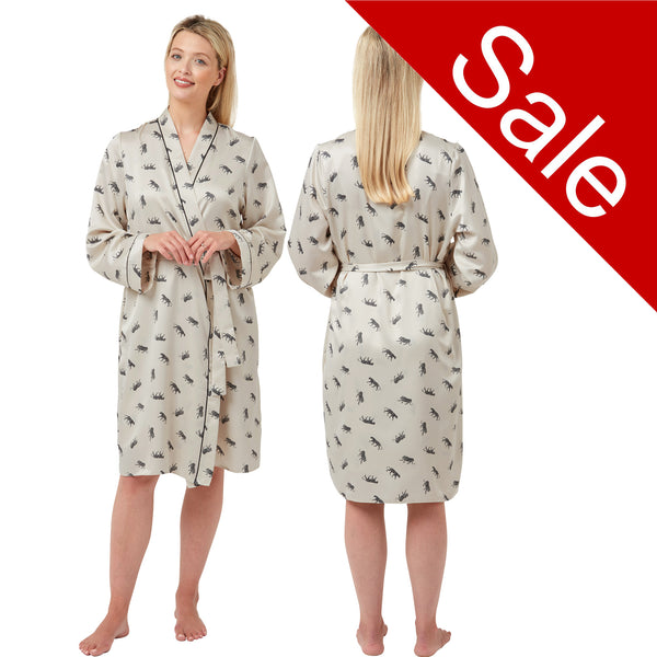 Cheetah animal print style with a ivory background in a silky mat satin wrap, dressing gown, bathrobe, kimono which is knee length with adjustable straps and a vee neck detail in UK sizes 10, 12, 14, 16, 18, 20